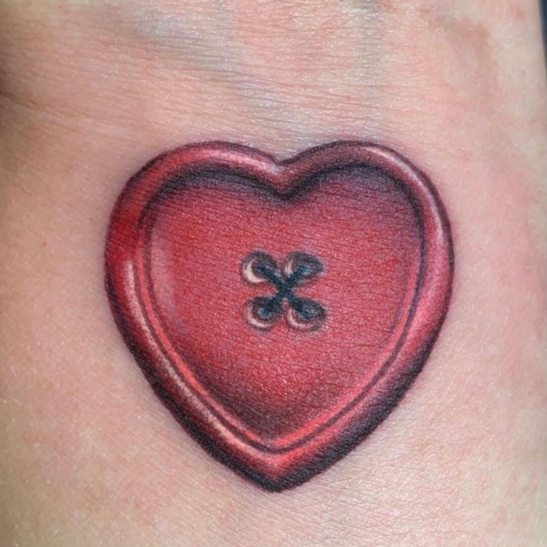 Beautiful Heart Shaped Button Tattoo Design