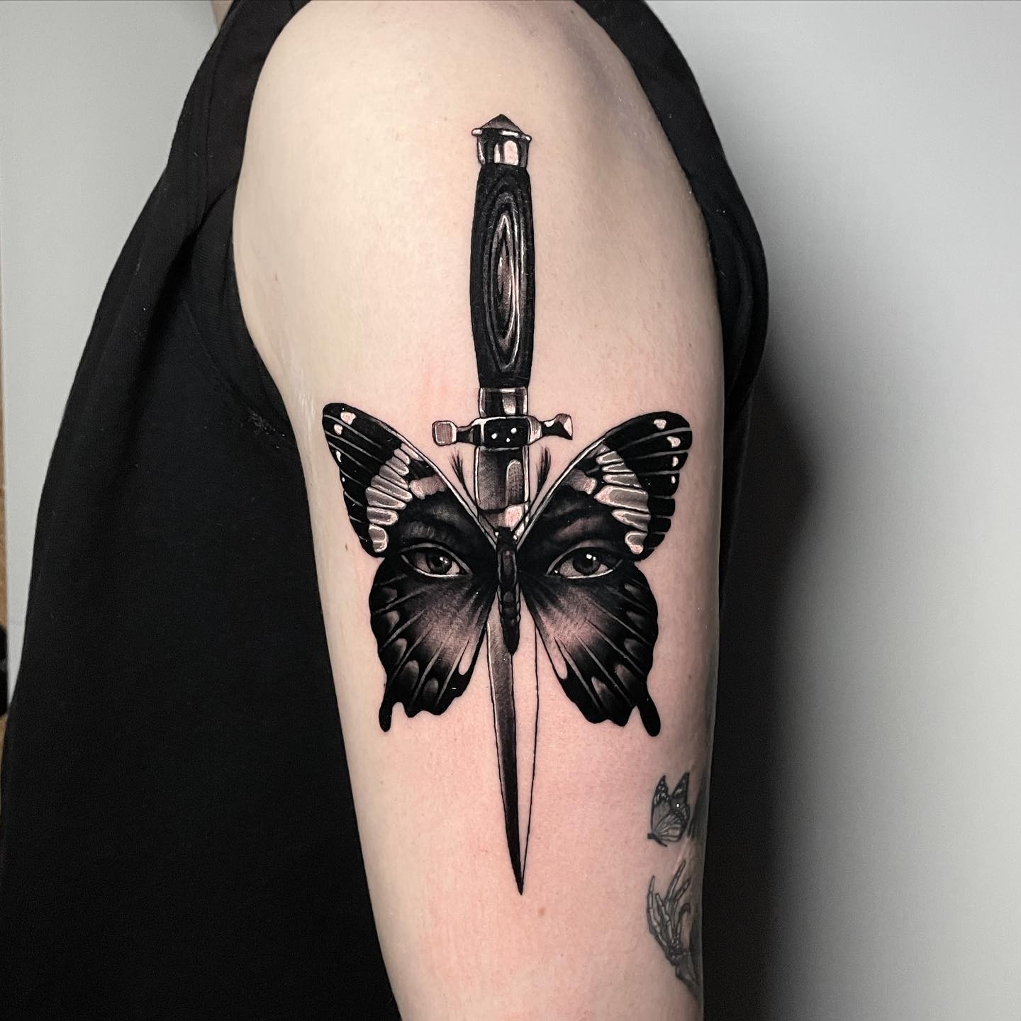 Black Butterfly With A Dagger Tattoo