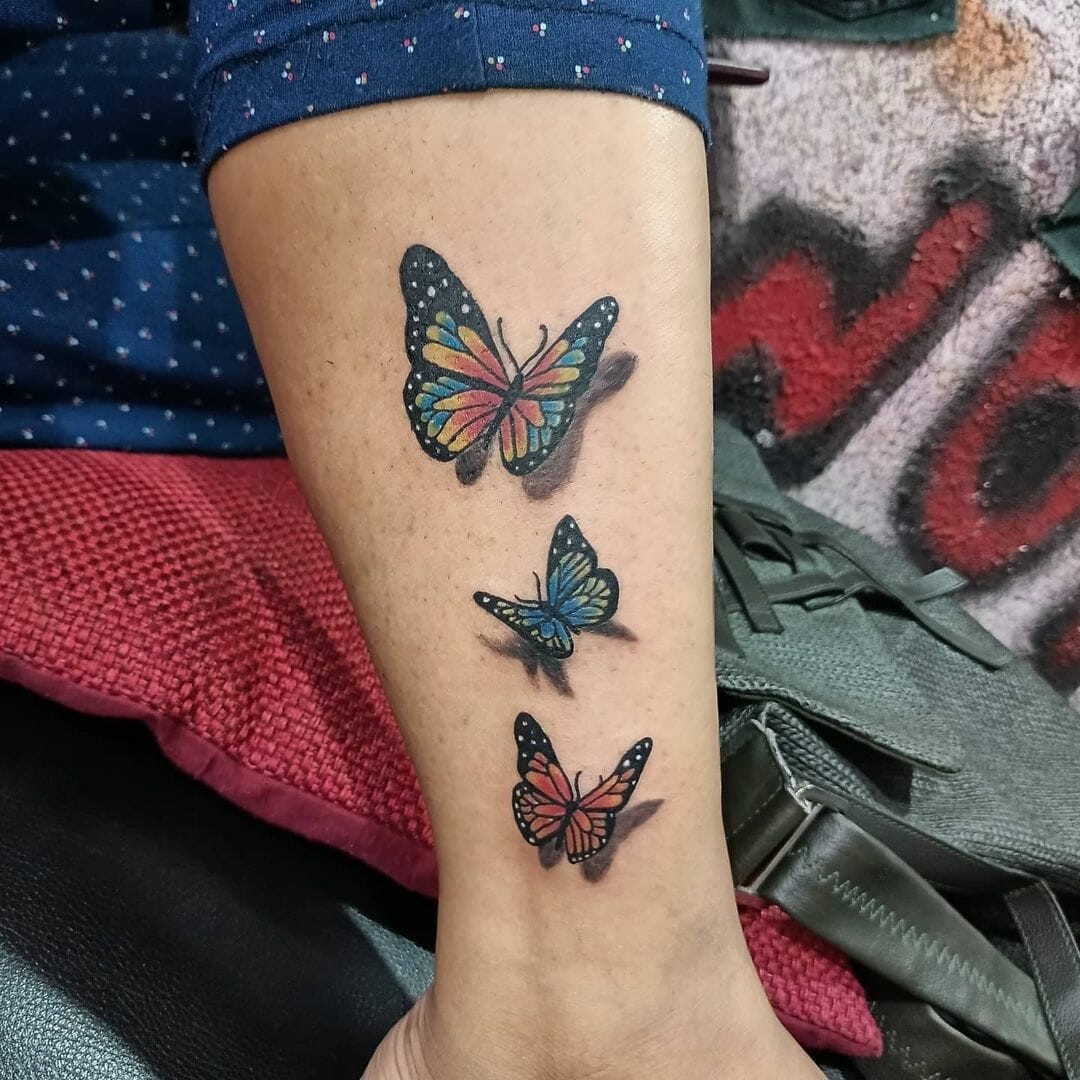 The Delicate Blue Butterfly Arm Tattoos