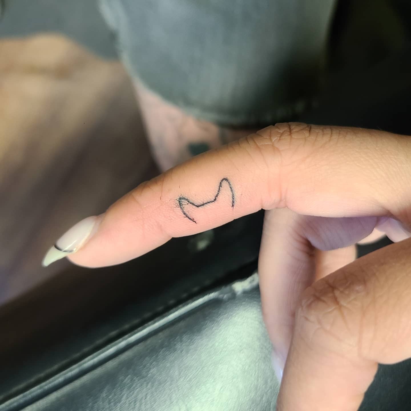 Dog Ear Finger Tattoo