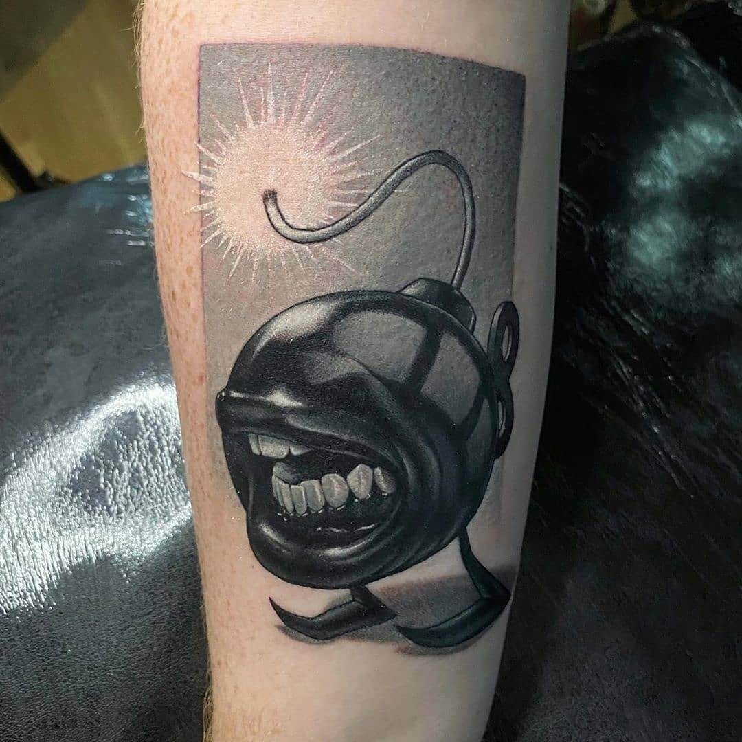 Weird Surrealism Tattoos Ideas For Men A Realistic Bomb With Human Teeth Design