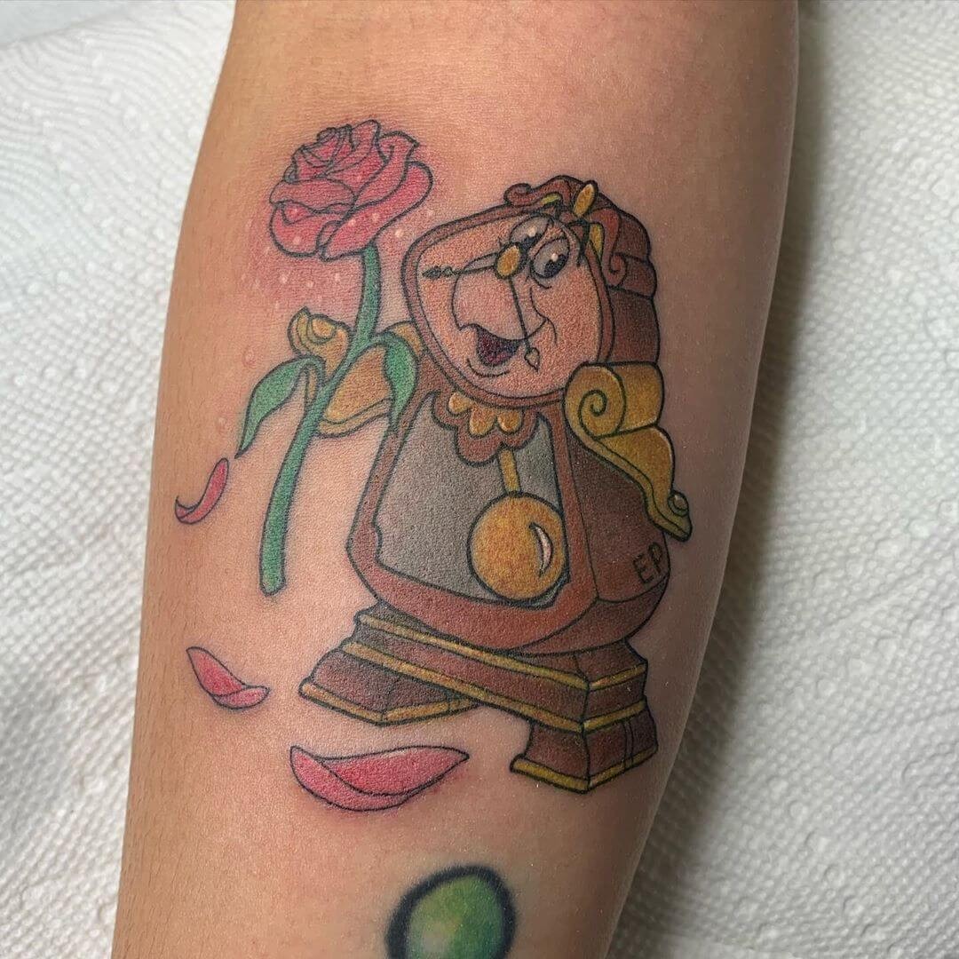 Classic Disney Tattoos Animated Beauty And The Beast Cogsworth Enchanted Rose Tattoo