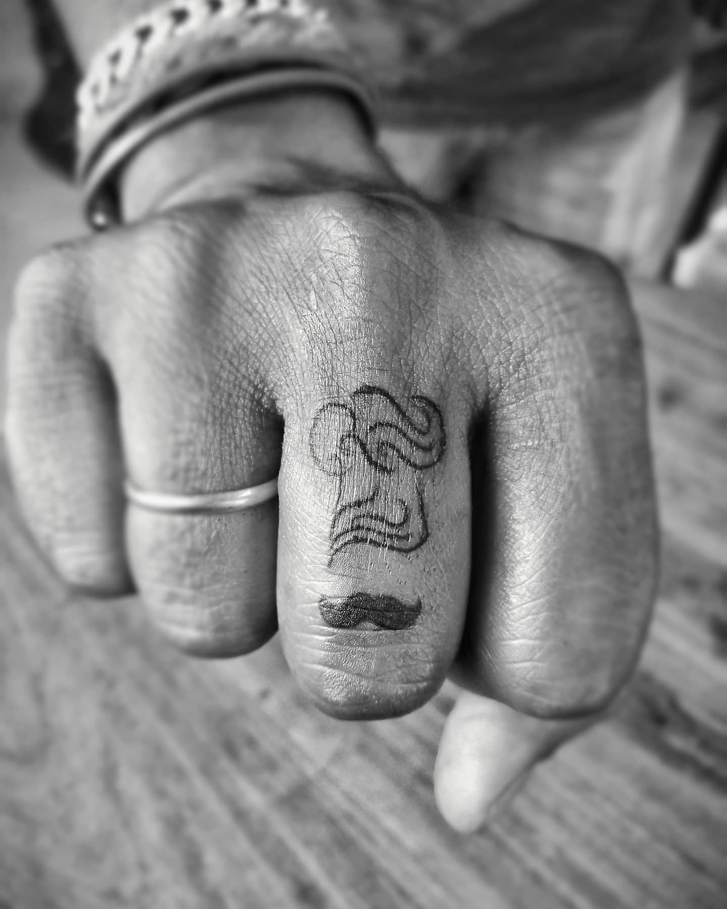 Dark Black Small Chef Tattoo On Finger