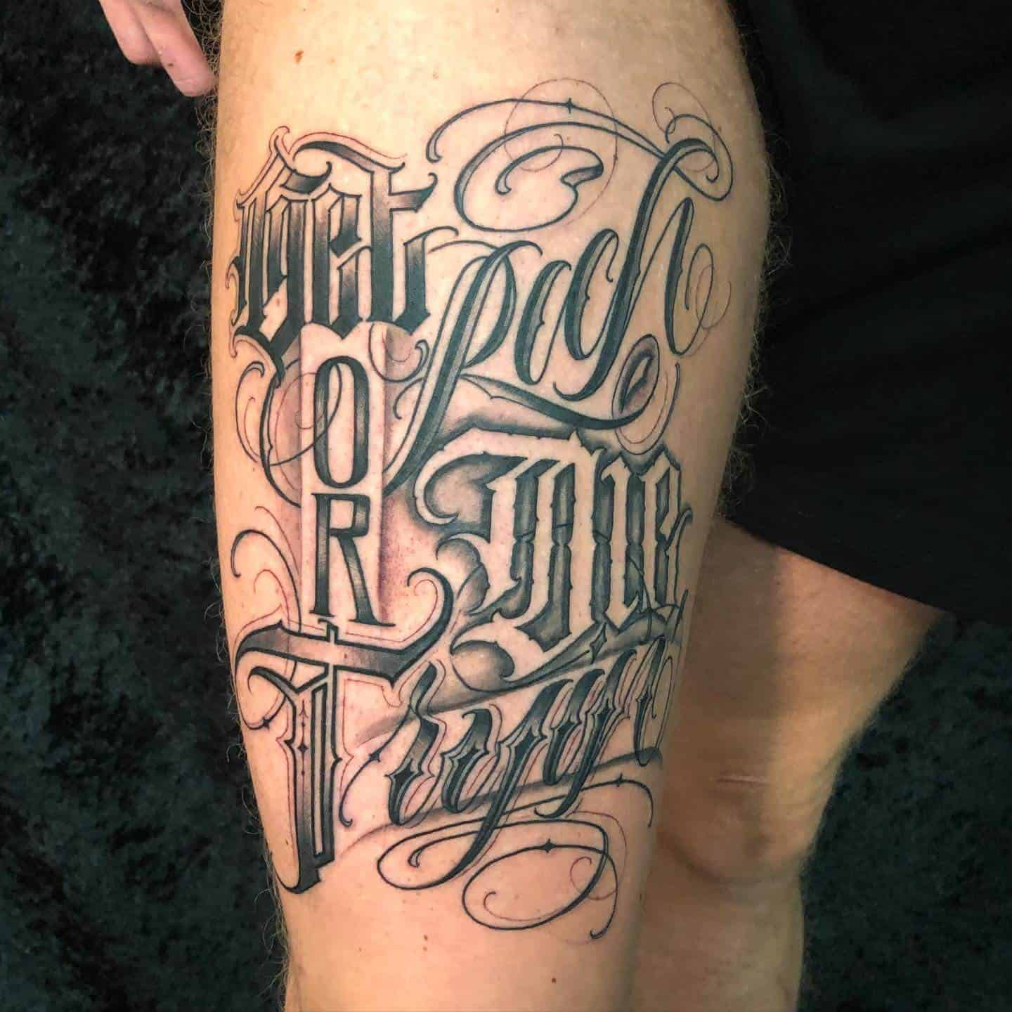 Get Rich Or Die Tryin Tattoo On Thigh