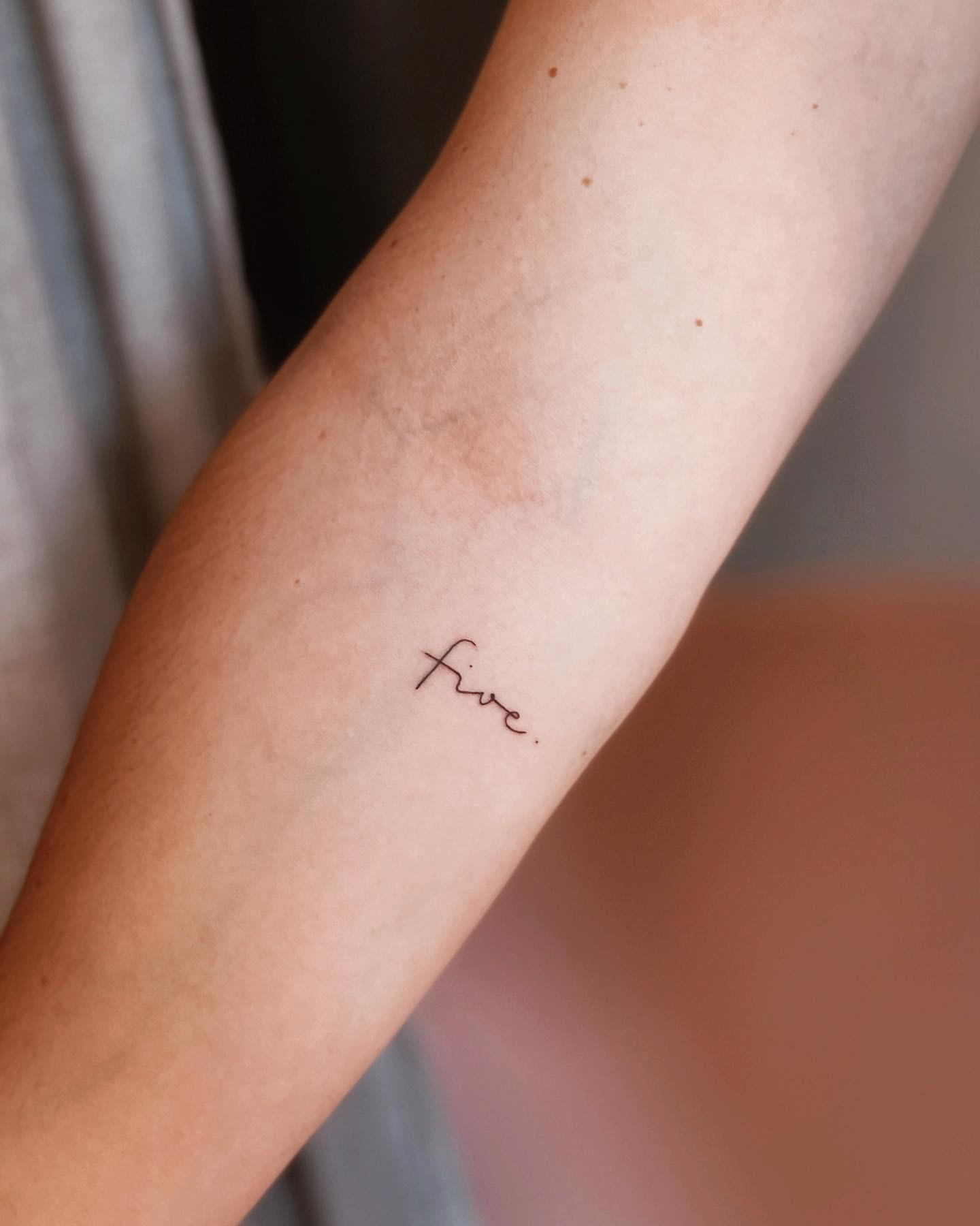 Minimalistic Handwriting Tattoo