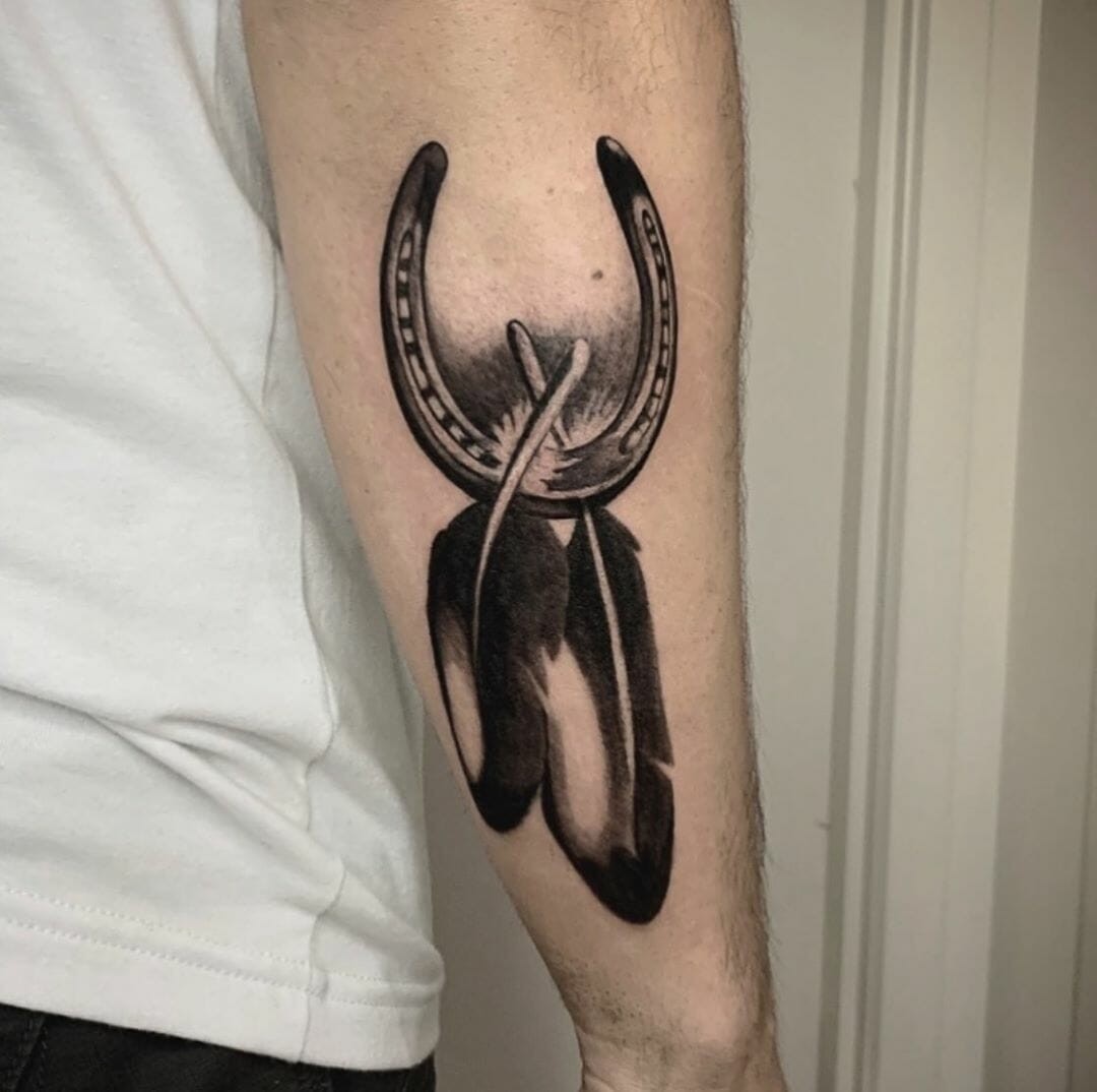 Horseshoe Tattoo With Feathers Meaningful Arm Tattoo Designs For Men