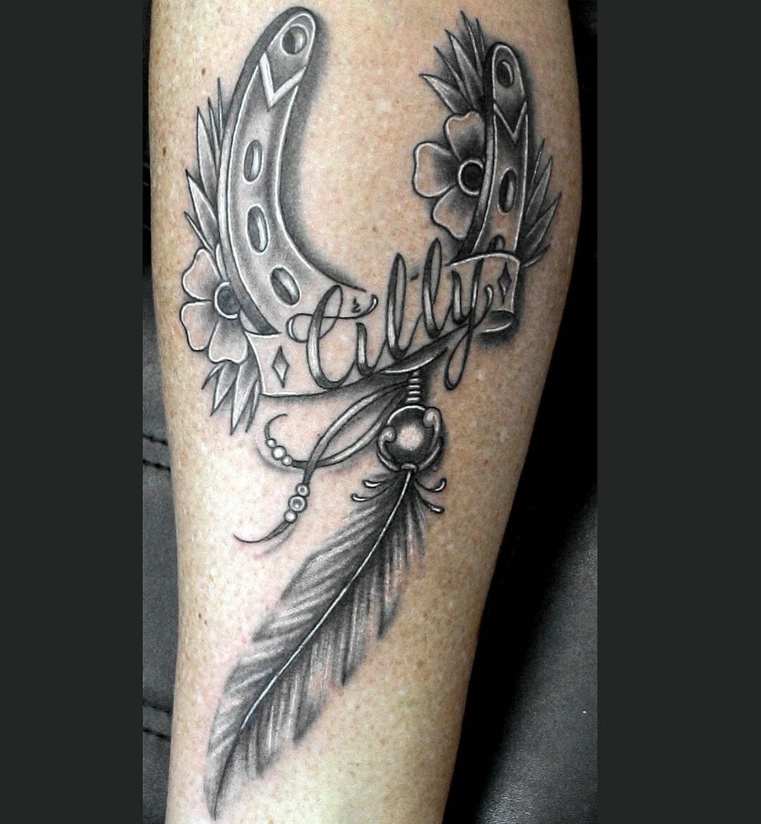 Cool Black and White Ink Horseshoe and Feather Tattoo To Bring Fortune