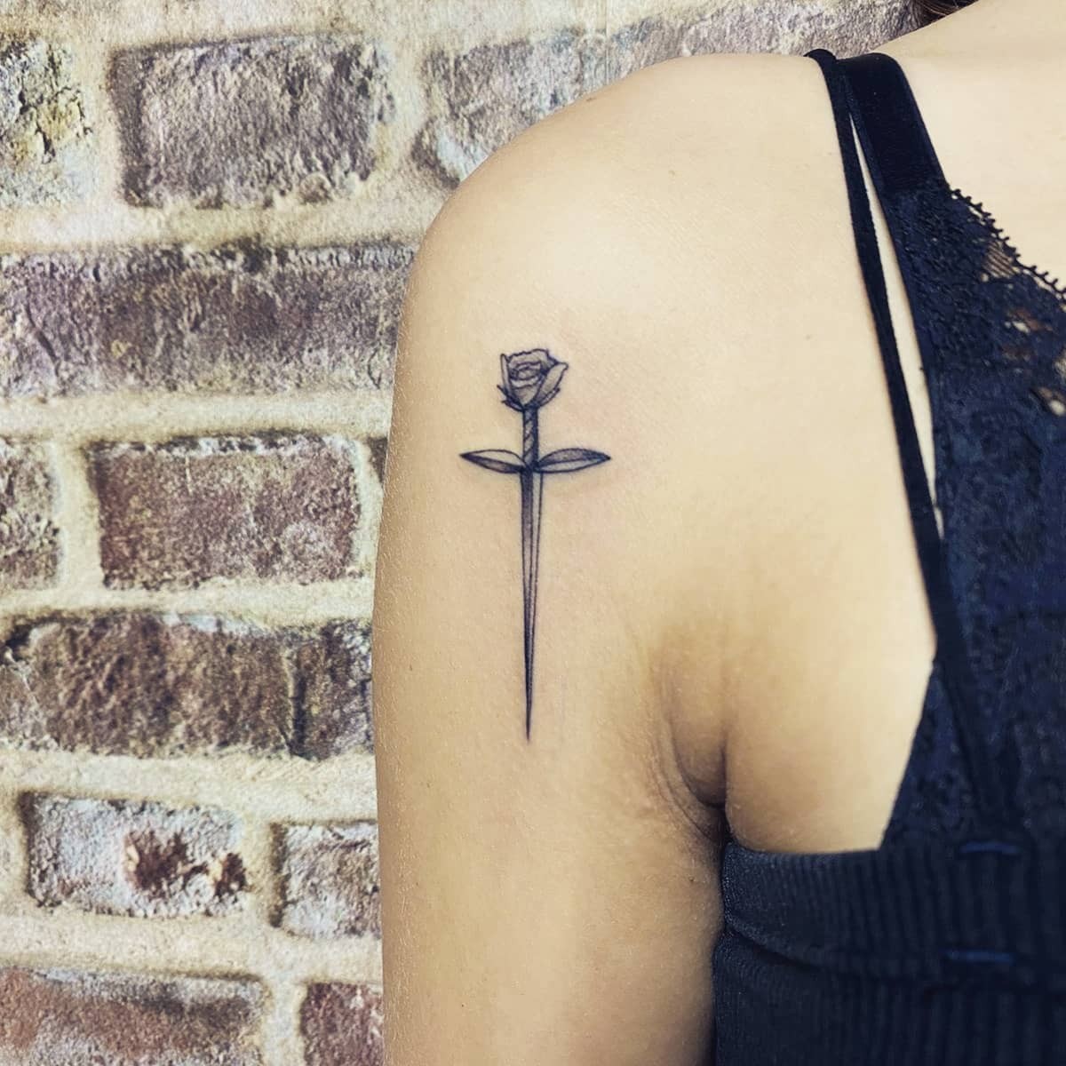 Simple Sword And Rose Tattoo