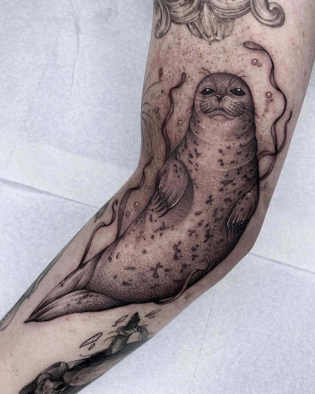 A Blackwork Seal Tattoo