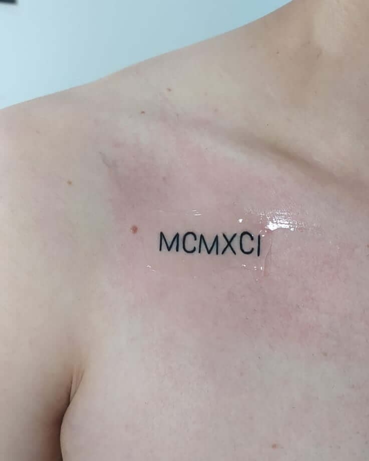 Unique Upper Chest Roman Numerical Tattoo