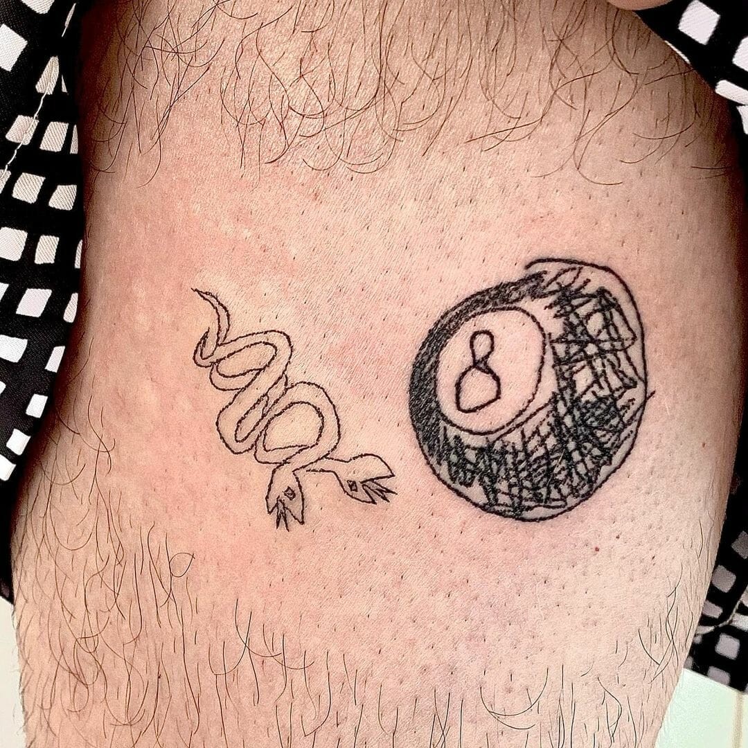 Offbeat And Unique 8 Ball Tattoo