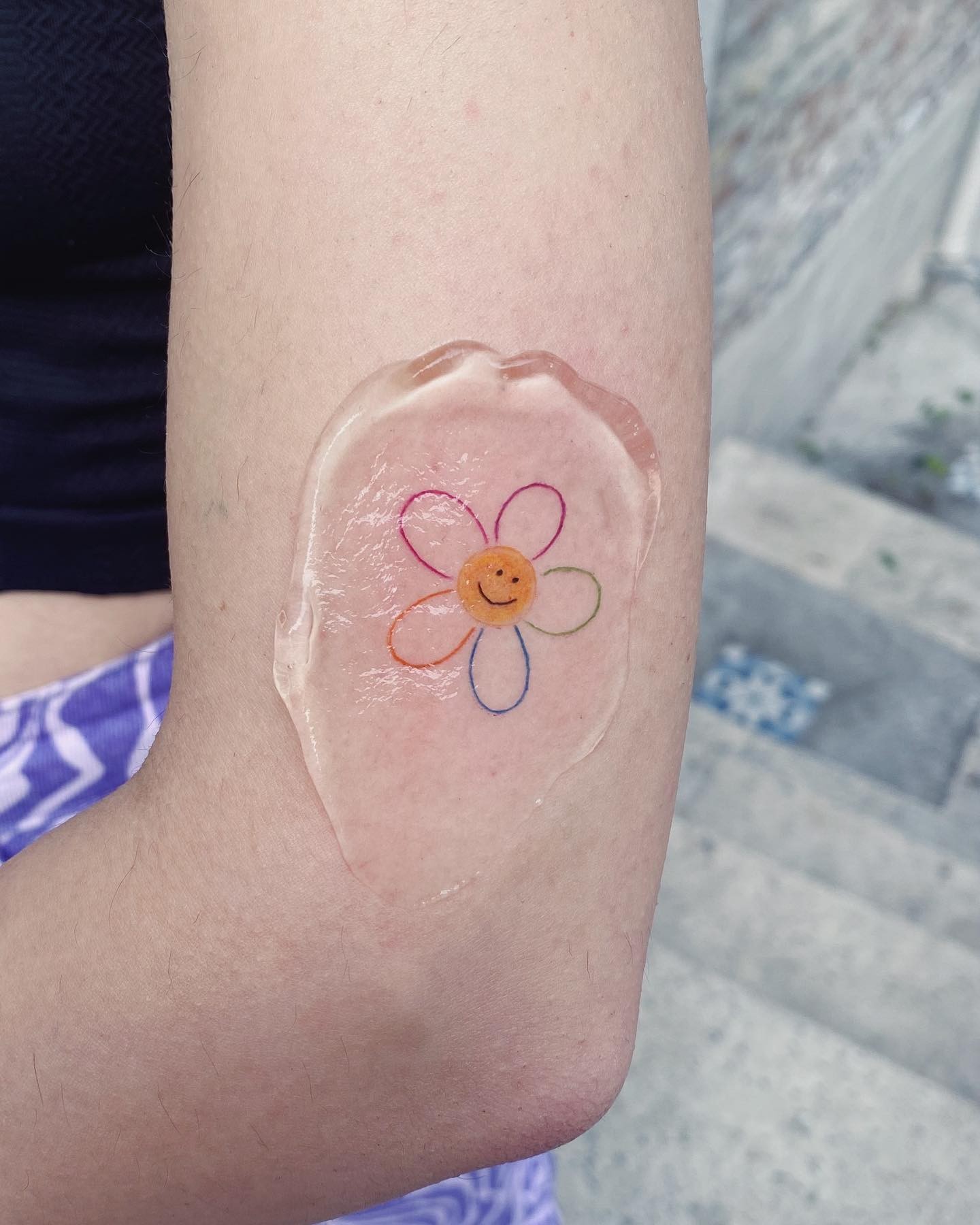 Simple Rainbow Flower Tattoo