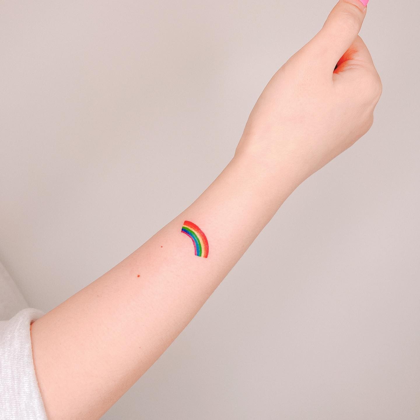 Minimal Rainbow Tattoo Design For The Wrist